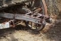 Close up of old rusty wooden wagon connecting mechanism, wheel v Royalty Free Stock Photo