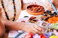 Close up with old senior hands taking food to eat from the table at home or restaurant - couple and friennds having lunch together Royalty Free Stock Photo