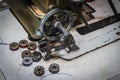 Close up of old sewing machine bobbins on work table. Tailor`s work table. textile or fine cloth making Royalty Free Stock Photo