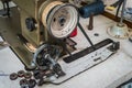 Close up of old sewing machine bobbins on work table. Tailor`s work table. textile or fine cloth making. Royalty Free Stock Photo