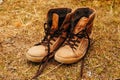 Close up old shoes on grass background, process vintage tone