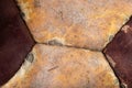 Close-up of an old soccer ball on the leg on a white table. Leather and destroyed ball without air Royalty Free Stock Photo