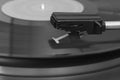 Close-up of a old stereo vinyl record player. Stylus over a vinyl record