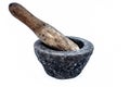 Close up of old vintage mortor and pestle isolated on white till date used in Asian and Indian homes for grinding and crushing spi