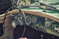 Close up on Old Vintage Steering wheel and cockpit