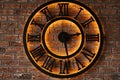 Close up old vintage wall clock over background of grunge brick wall Royalty Free Stock Photo