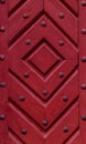 Close up of old vintage wooden door with metal furniture.  Red wooden fence background texture Royalty Free Stock Photo