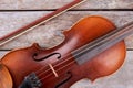Close up old violin on wooden background. Royalty Free Stock Photo