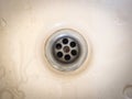 Close up of old water drain of bathtub with stains Royalty Free Stock Photo