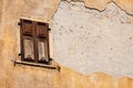 Window with wooden shutters and broken wall - Trentino Italy Royalty Free Stock Photo