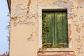 Window of Abandoned Building with Creeper Plants and Broken Wall Royalty Free Stock Photo