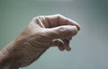 Close up of an old woman's hand on a blurred background Royalty Free Stock Photo