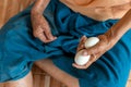 Close-up of the old woman's hand Poor Thai grandmother holds a large white duck egg for dinner. Pure egg Royalty Free Stock Photo
