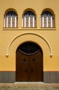 Close-up of old wooden arched entrance door way