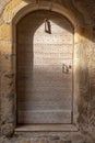 Close-up of an old wooden building entrance door in the historical district of Figeac, France