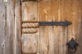 Close-up of old wooden door on metal hinges