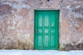 Close-up of old wooden door in winter time. Royalty Free Stock Photo