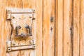 Old door knocker on rustic wood front door, close-up Royalty Free Stock Photo