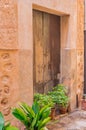 Old mediterranean wood front door of rustic house Royalty Free Stock Photo