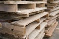Close-up old wooden pallets.Wood pallet in factory area use for carry material and product supply to customers.Selective focus Royalty Free Stock Photo