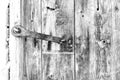 Close-up, of an old wooden rustic door in black and white. Vintag