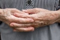 Close-up of old, wrinkled and arthritic female fingers. Hands of an elderly person