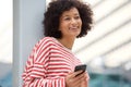 Close up older african american woman laughing with cellphone outdoors Royalty Free Stock Photo