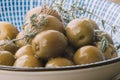 close-up of olive plate with thyme