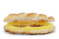 close-up of one bagel cut in two, with a yellow cream spread inside it