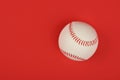 Close up one baseball ball over red Royalty Free Stock Photo