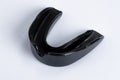 A black gumshield on a white background