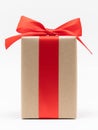 Close-up brown paper gift box red bow ribbon white background. concept for happy love gift Royalty Free Stock Photo