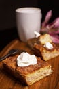 Close up of one Churro Cheesecake piece and a drink on a wooden base Royalty Free Stock Photo