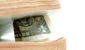 Close up of one dollar between old book pages Royalty Free Stock Photo