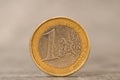 Close-up of one Euro coin on the grey stone background Royalty Free Stock Photo