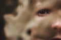 Close up one eye of a young woman covered with leaf Royalty Free Stock Photo