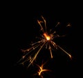 Close up one firework sparkler over blue bokeh Royalty Free Stock Photo