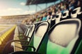 close-up of one free seat on the grandstand, with view of the race track and cheering fans in the background