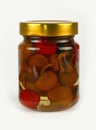 Jar of pickled red and green hot peppers on white Royalty Free Stock Photo