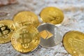 Close up one golden coin and silver coin with the bitcoin symbol and ethereum symbol