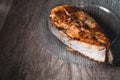 Close-up one grilled cum salmon keta fish steak on a glass transparent plate on a dark wood table background. A little Royalty Free Stock Photo