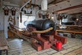 Close up of one of HMS Warriors cannons on the gun deck in Portsmouth Historic Dockyard, Hampshire, UK Royalty Free Stock Photo