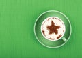 Close up latte cappuccino coffee in cup on green Royalty Free Stock Photo