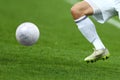 Close up one leg and feet of football player with the ball Royalty Free Stock Photo