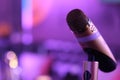 Close up one microphone in KTV with purple bokeh