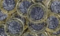 Close up of One Pound Coins - British Currency Royalty Free Stock Photo