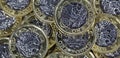 Close up of One Pound Coins - British Currency Royalty Free Stock Photo