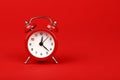 Close up one red alarm clock over red background Royalty Free Stock Photo