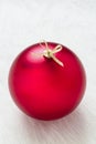 Close up of one simple perfect big red Christmas ornament decoration on white background vertical and empty blank copy space