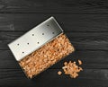 Metal smoker box with wood chips on table Royalty Free Stock Photo